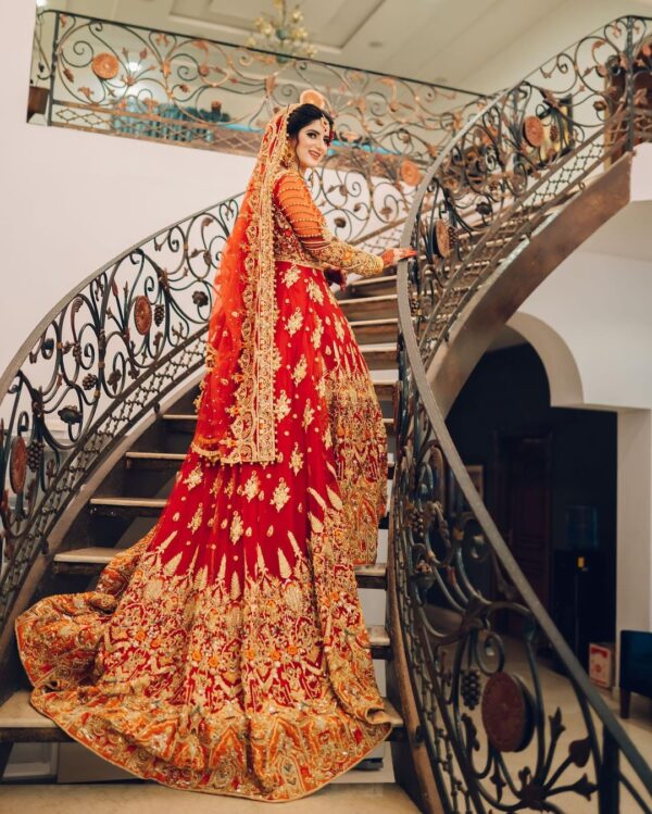 red bridal long trail gown with handwork