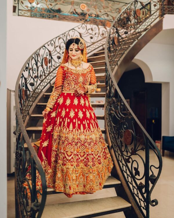 red and golden bridal long trail gown