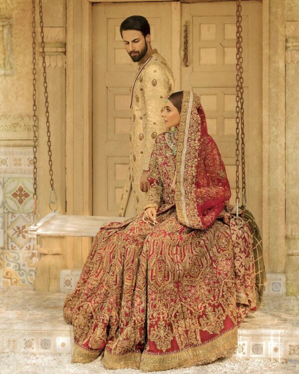 red bridal long trail lehenga with anarkali