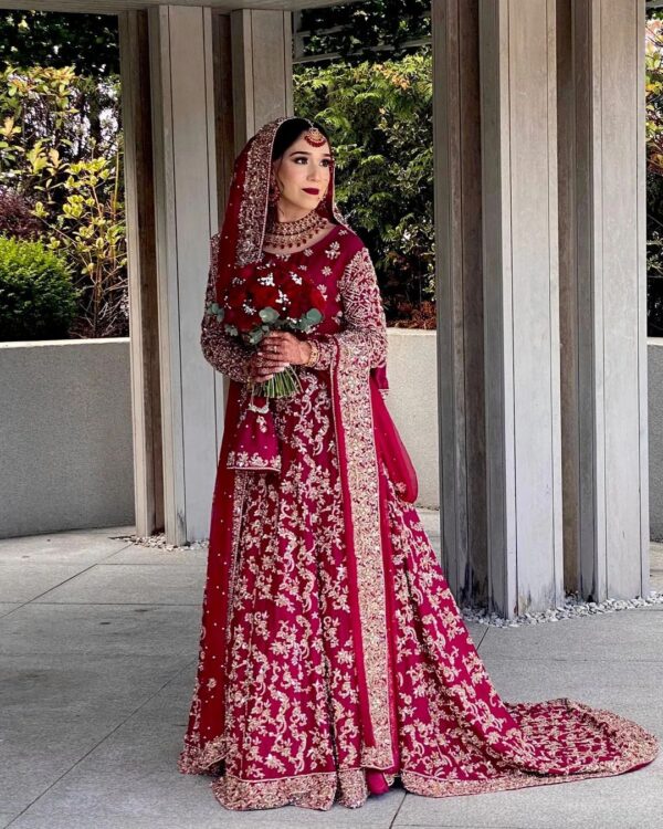 red and golden wedding long trail lehenga with kurti