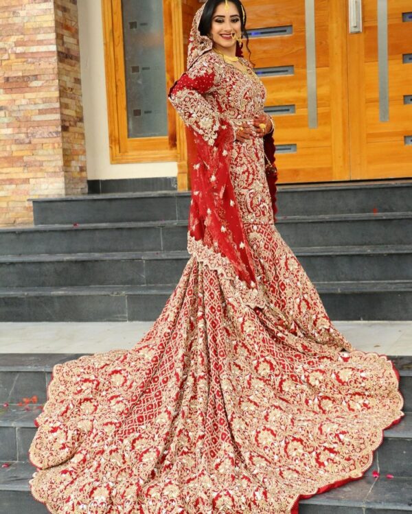 designer wedding long trail gown with golden embroidery