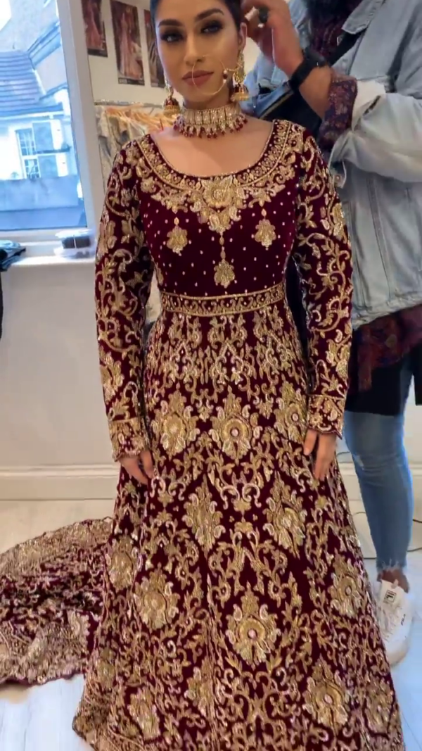 designer wedding long trail gown with golden embroidery
