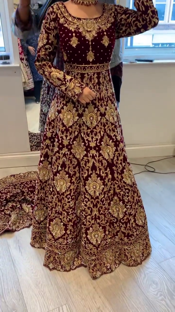 maroon wedding long trail gown with handwork
