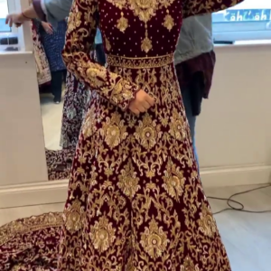 maroon bridal gown with long trail