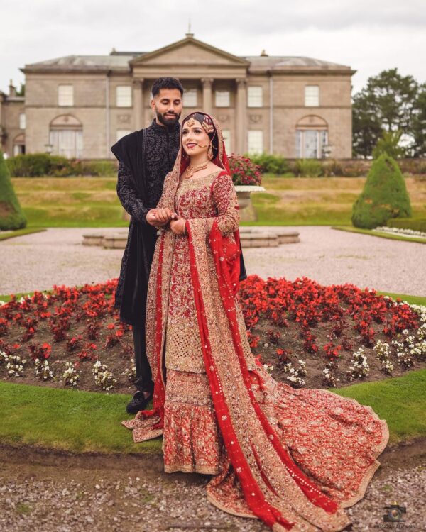 Red and golden bridal long trail frill lehenga with kurti
