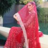 Designer red net saree with intricate handwork detailing