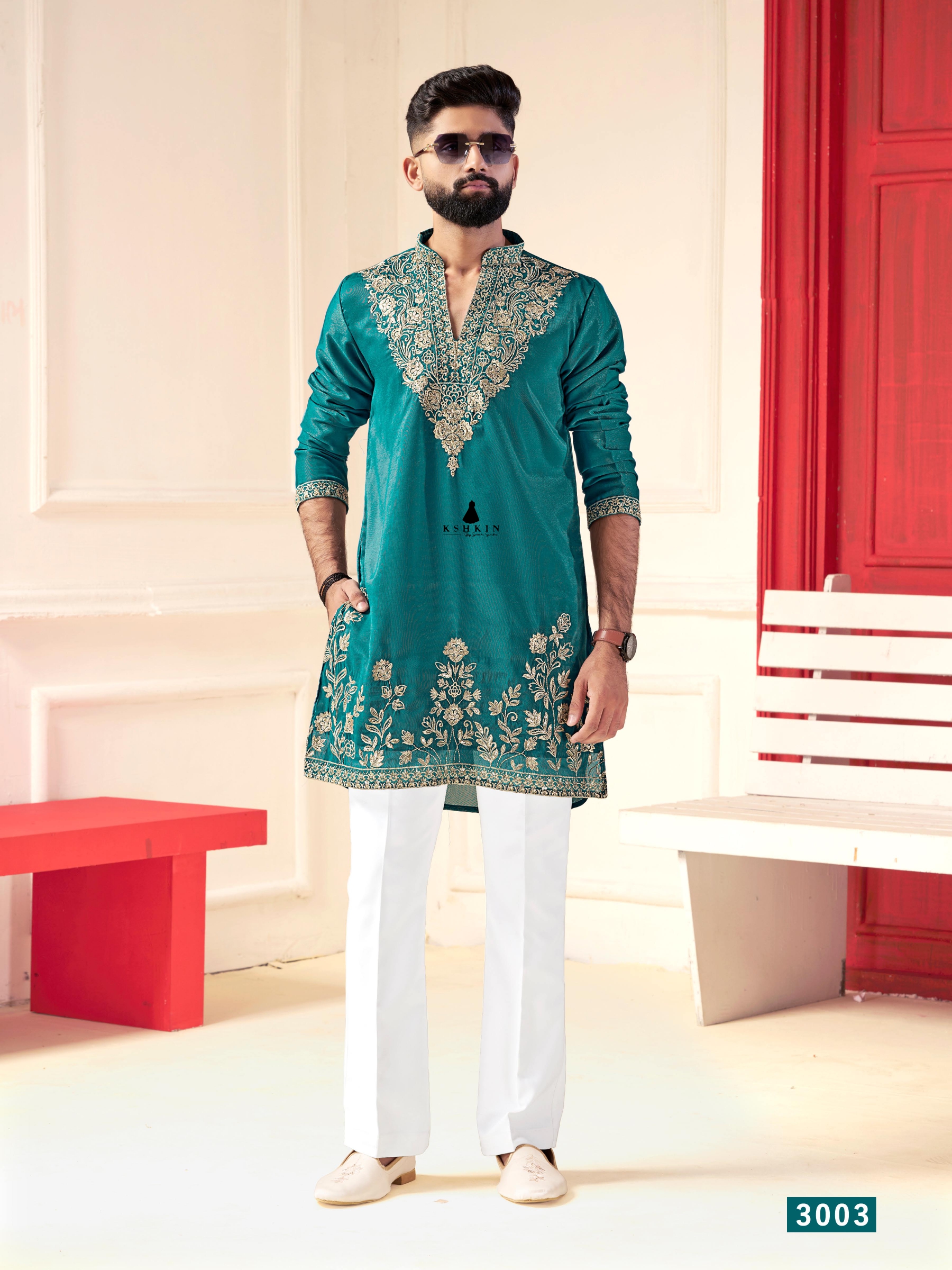 Men's teal green silk two-piece kurta set with matching trousers for festive wear