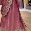 Dusty pink embroidered long Angrakha style suit featuring intricate handwork details paired with flared plazo and matching potli bag