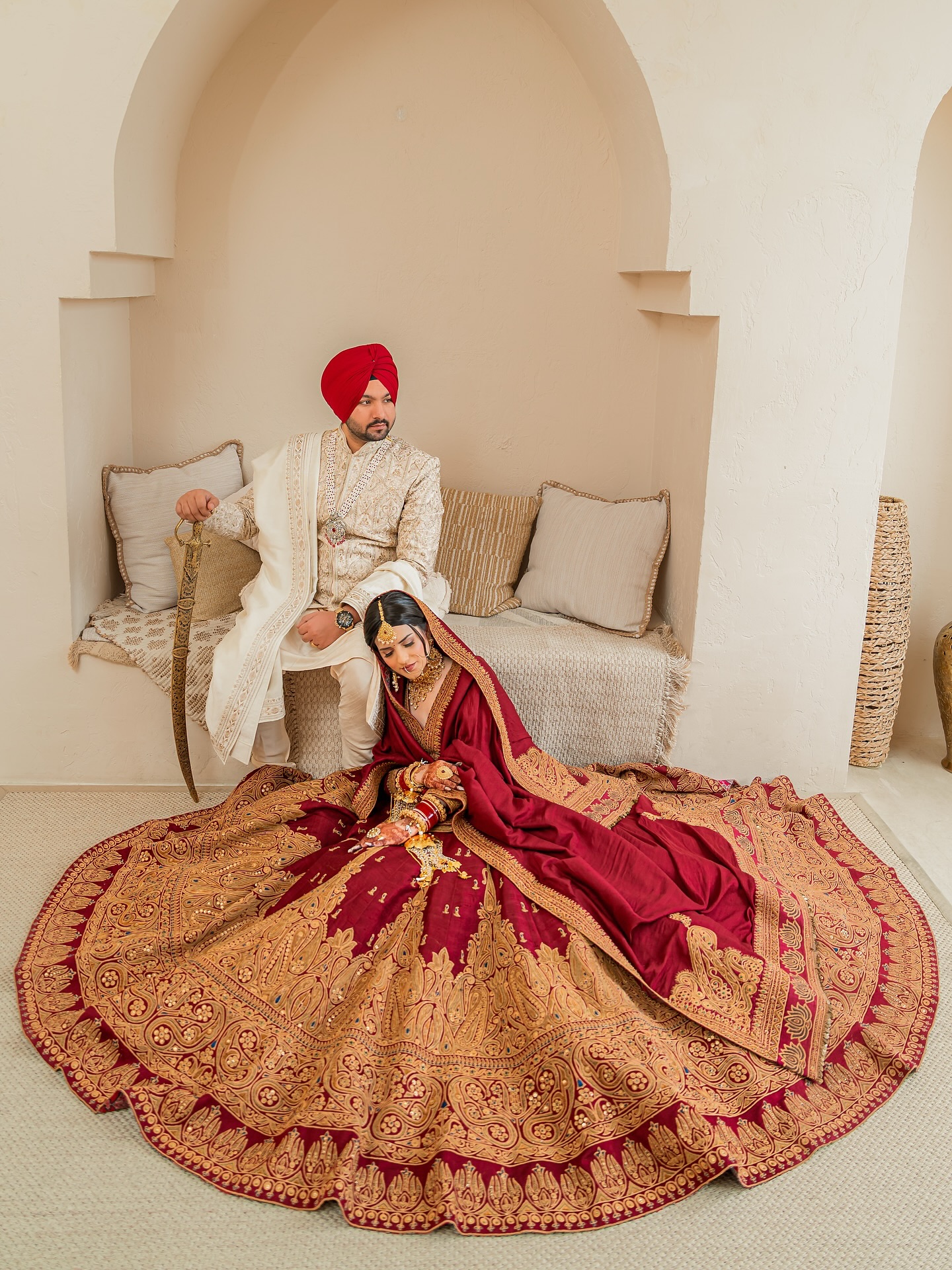 Regal red Punjabi bridal outfit with heavy ethnic craftsmanship