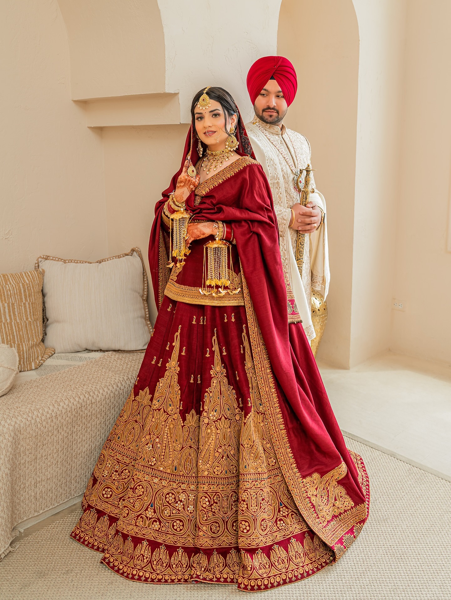 Luxury bridal wear red anarkali-style long choli lehenga with tilla work