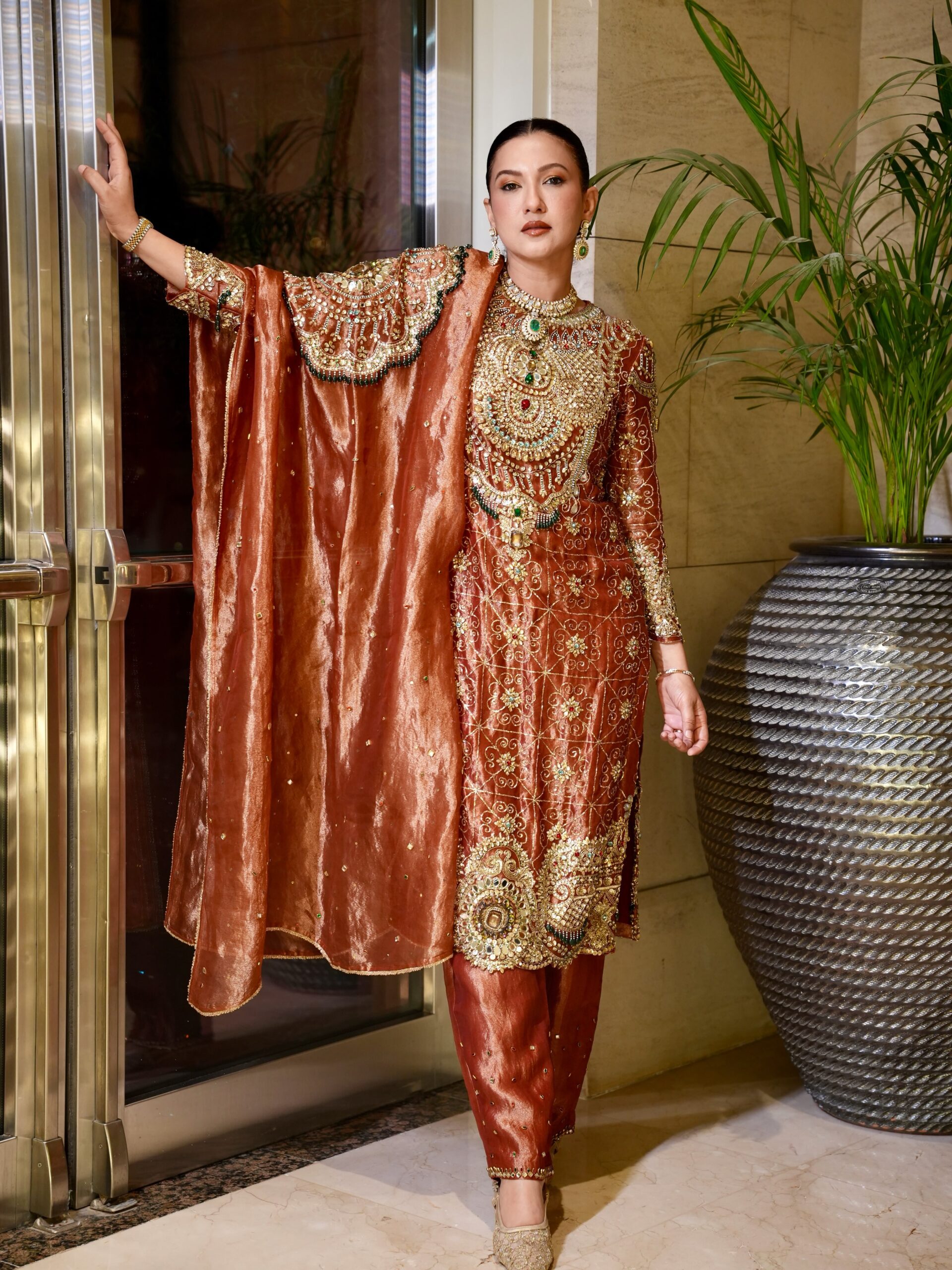 Full-length view of a celebrity-inspired ethnic suit for festive occasions