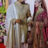Regal golden net and zamavar bridal gown featuring heavy ethnic zardosi hand embroidery