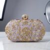 Elegant handcrafted ethnic clutch with intricate gold embroidery